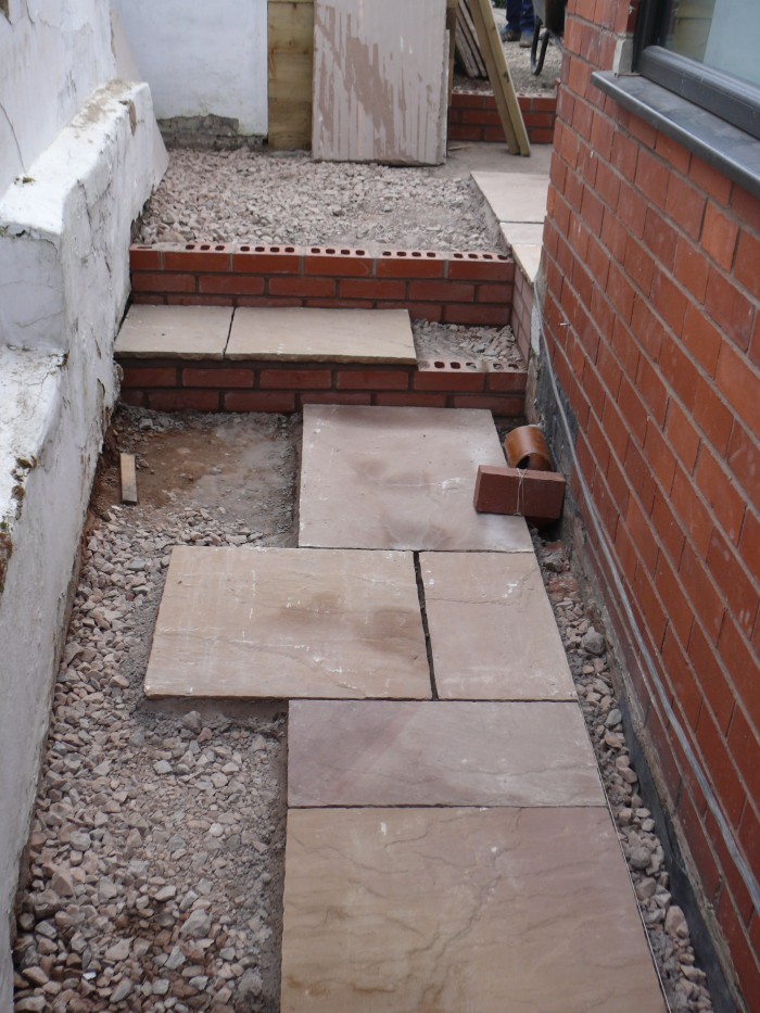 Laying the Indian stone path - Landscaping in Stoke-on-Trent
