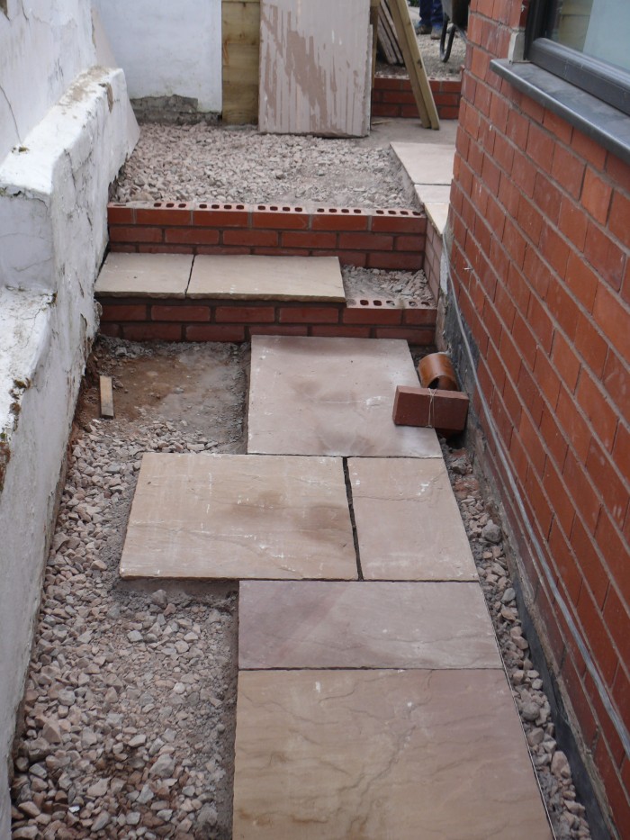 Laying the Indian stone path - Landscaping in Stoke-on-Trent Laying the Indian stone path - Landscaping in Stoke-on-Trent