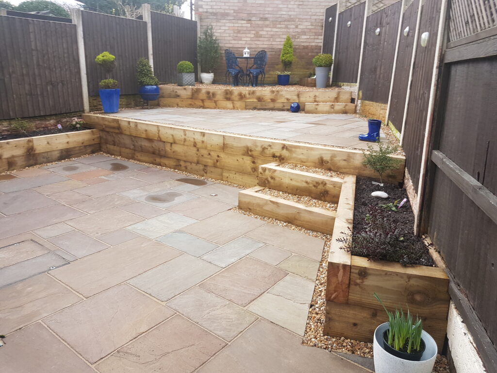 After Landscaping - Sleeper beds, sleeper steps | Blue Iris Landscapes Landscaping Awkward Spaces