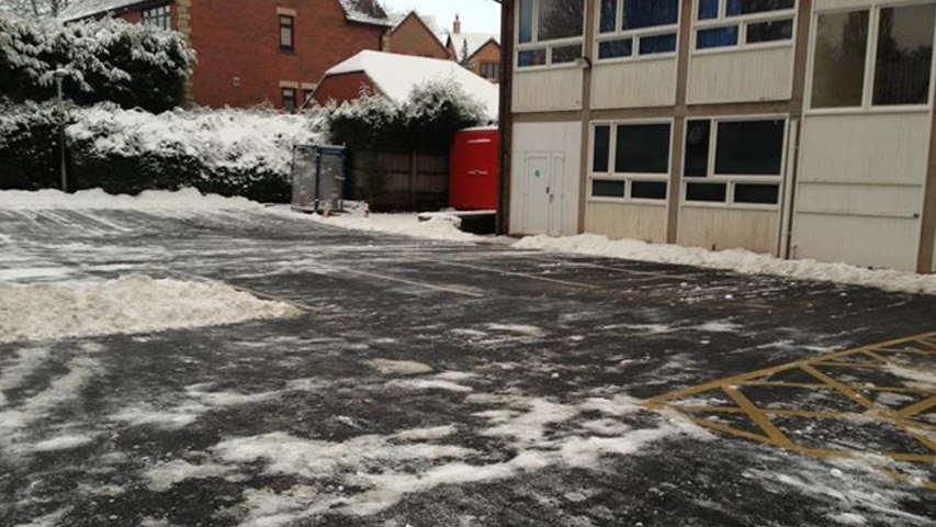 Clearing snow in a car park